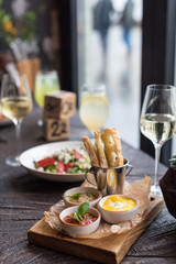 Assorted Appetizers and Wine. Roasted Aubergine Dip, Tomato Basil Sauce and Cream Cheese with Fruit