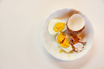 tokyo, japan, 11/17/2019 , broken boiled egg with its shell on a plate