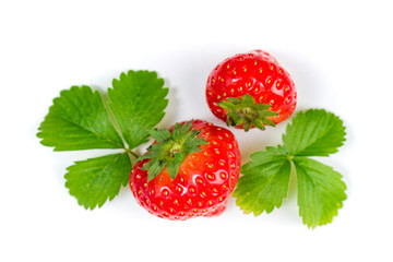 Strawberry on white background, top view. Berries background. Fresh strawberry with green leaves isolated on white. Creative food concept. Flat lay