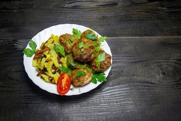 fried potatoes with chop and fresh tomatoes