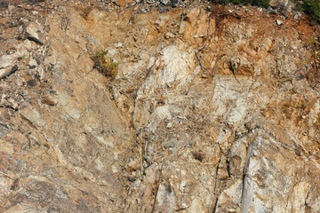 Concrete wall texture background. Natural stones. Building's facade decor. Decorative plaster. House exterior.