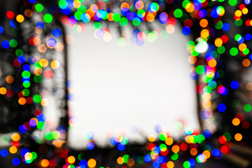 Frame made of Christmas blur colorful light on the background white color