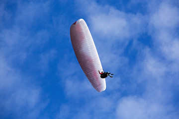 Nate Anglen is towed up to altitude by his father during a paragliding outing in north Idaho. A winch on the car slowly feeds out thousands of feet of line as the pilot rises into the air. Once at a proper altitude the pilot releases the line and glides away.