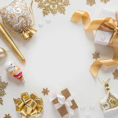 Christmas decorations in gold colors on white background