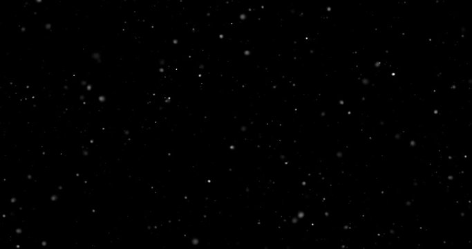 Flying dust particles on a black background