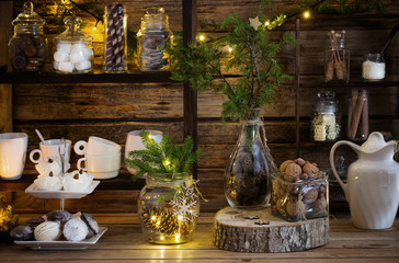 Christmas decoration cocoa bar with cookies and sweets on old wooden background in  natural rustic style. Winter cozy concept