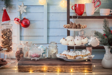 Christmas bar cacao decoration with cookies and sweets on blue wooden background in vintage style