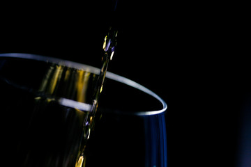 Brandy falling into a cup.