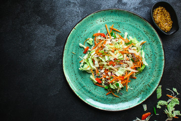 vegetable salad (Chinese cabbage, carrot, onion, lettuce, mix salad) menu concept. food background. top view. copy space