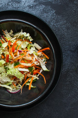 vegetable salad (Chinese cabbage, carrot, onion, lettuce, mix salad) menu concept. food background. top view. copy space