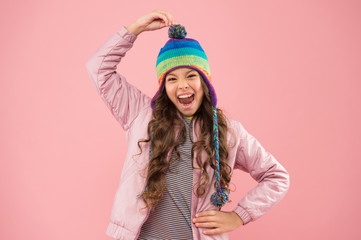 dont like hats. warm clothes for cold season. child pink background. autumn style. happy childhood. kid fashion and shopping. trendy girl shouting. small girl winter hat. ready for winter activity