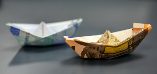 Paper boat made with Euro bills.