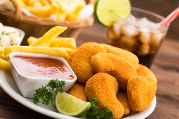 Chicken nuggets with ketchup on the plate
