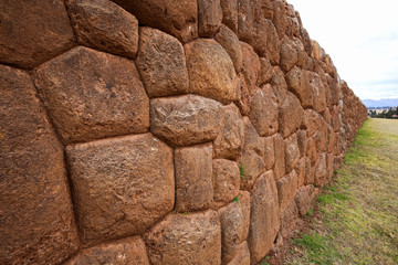 A stone wall in the Inca ruins. Chinchero, Peru.