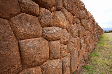 A stone wall in the Inca ruins. Chinchero, Peru.