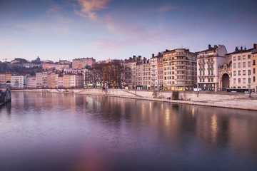 Fototapeta na wymiar Lyon buildings along river Saone at sunset
