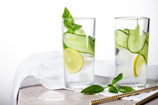 Cold lemonade with cucumber and green basil.