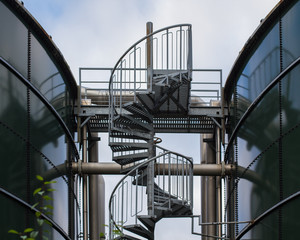 Naklejka premium industry: winding stairs between two gas storage tanks
