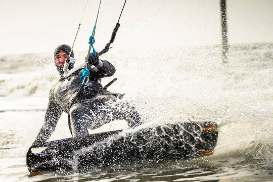 Man kitesurfing in sea
