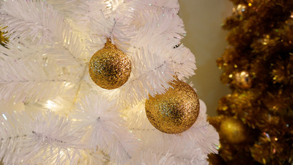 Christmas toy on the branches of a New Year tree. Christmas tree decorated with a festive ball