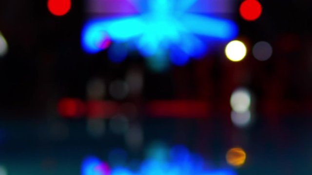 Blurred outdoor stage, LED screen and performance in night party. Turkish resort nightlife concept.