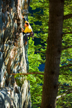 A man warms up on Spare Tire (5.10d) at Gallatin Tower.