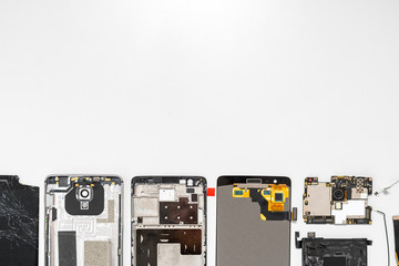 Details of broken modern smartphone on table