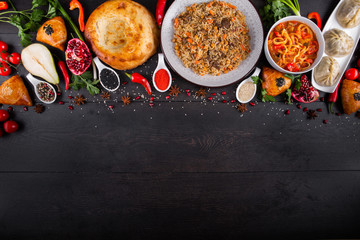 The concept of Eastern asian festive cuisine. Assorted Uzbek food set, pilaf, samsa, lagman, manta, shurpa restaurant concept, Uzbek food. Homemade Eastern arabic new year and Christmas dish from lamb