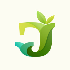 Swirling letter J logo with green leaves.