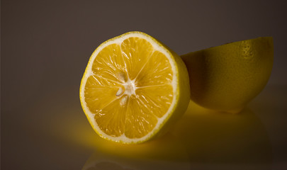 Yellow lemon on a dark background.