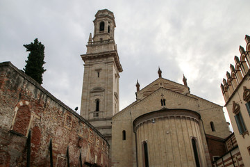 The picture from the center of the ancient city of Verona in Italy. The old historic houses and one of the churches. 