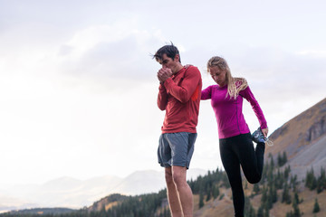 Gold King Basin, near Telluride, Colorado, USA: A female and male runner running the alpine trails at the Gold King Basin together.