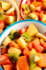 fruit salad in colorful bowls
