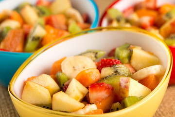 fruit salad in colorful bowls