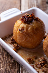 Vegan dessert, baked apples on rustic table