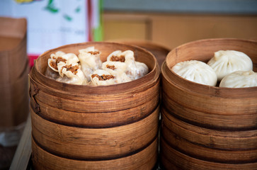 Fresh dim sum in bamboo steamer on Chinese food street