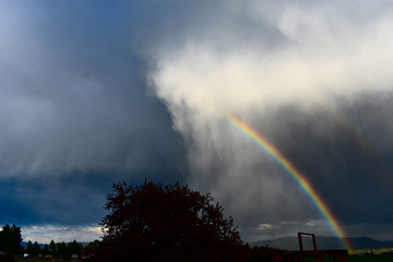 Beautiful Rainbow Leaving the Clouds 