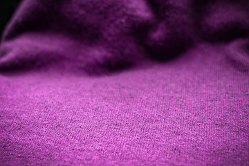 Fototapeta na wymiar magenta knitted fabric background, wool texture