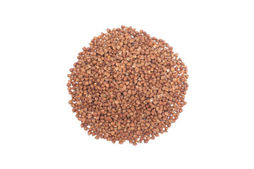 Heap of buckwheat groats isolated on white background.