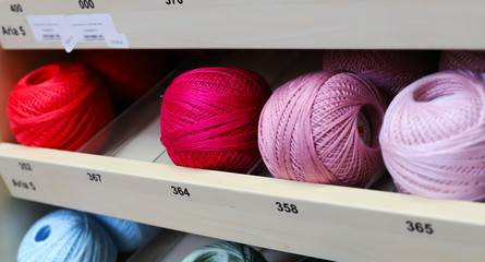 threads of different colors in the store in the coil and in the Babin concept fabric shop,thread factory and handmade