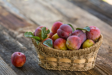 Sweet plums on wooden background