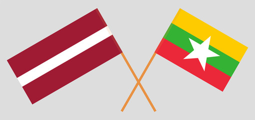 Crossed flags of Myanmar and Latvia
