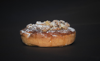 walnut cake on dark background