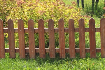 close-up of brown wooden protective fence decorative fence for garden