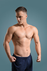 Fototapeta na wymiar Handsome male bodybuilder on grey background