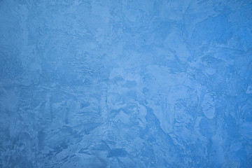 Frozen window patterns. Blue background. Abstraction. Frost