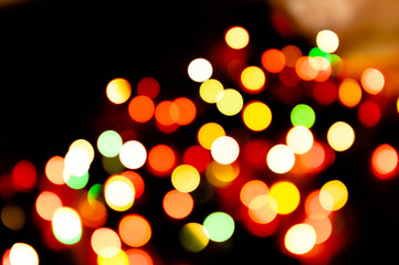 unfocused flameboyant bright blurred lights on dark background
