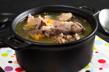 Chicken gizzards stewed with carrot in sauce.