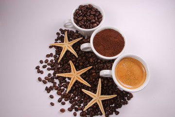 Three cups of coffee beans, powder and liquid - 304212140