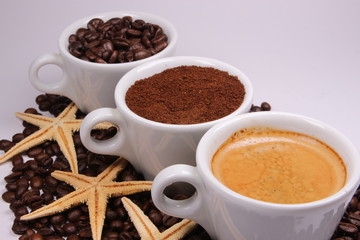 Three cups of coffee beans, powder and liquid - 304212145
